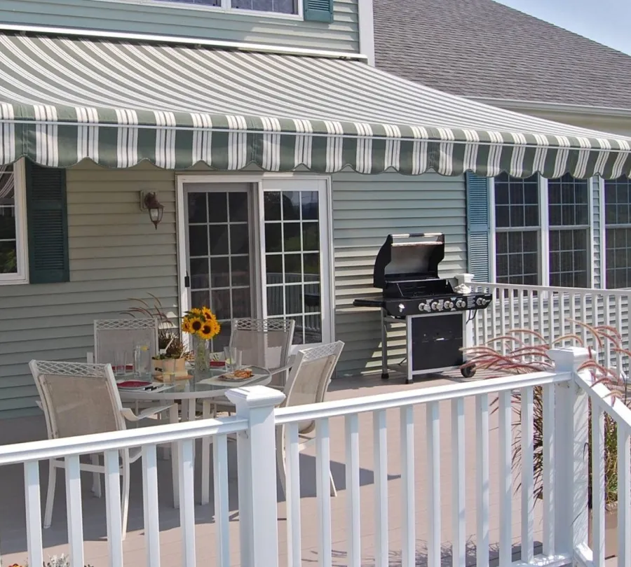 a house with a deck and a table and chairs