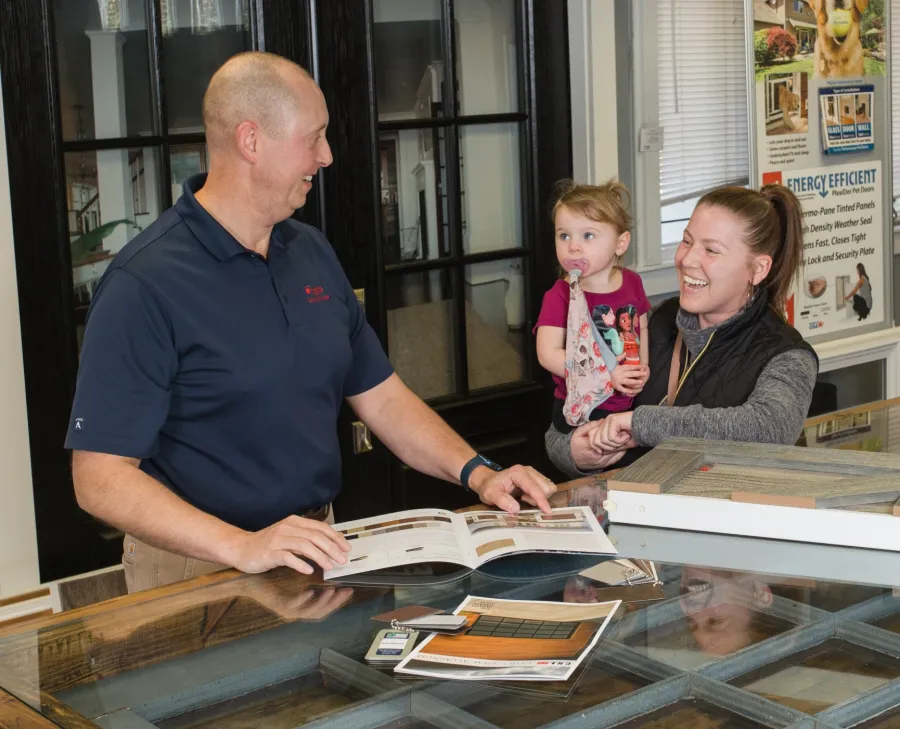 a man and a woman looking at a book