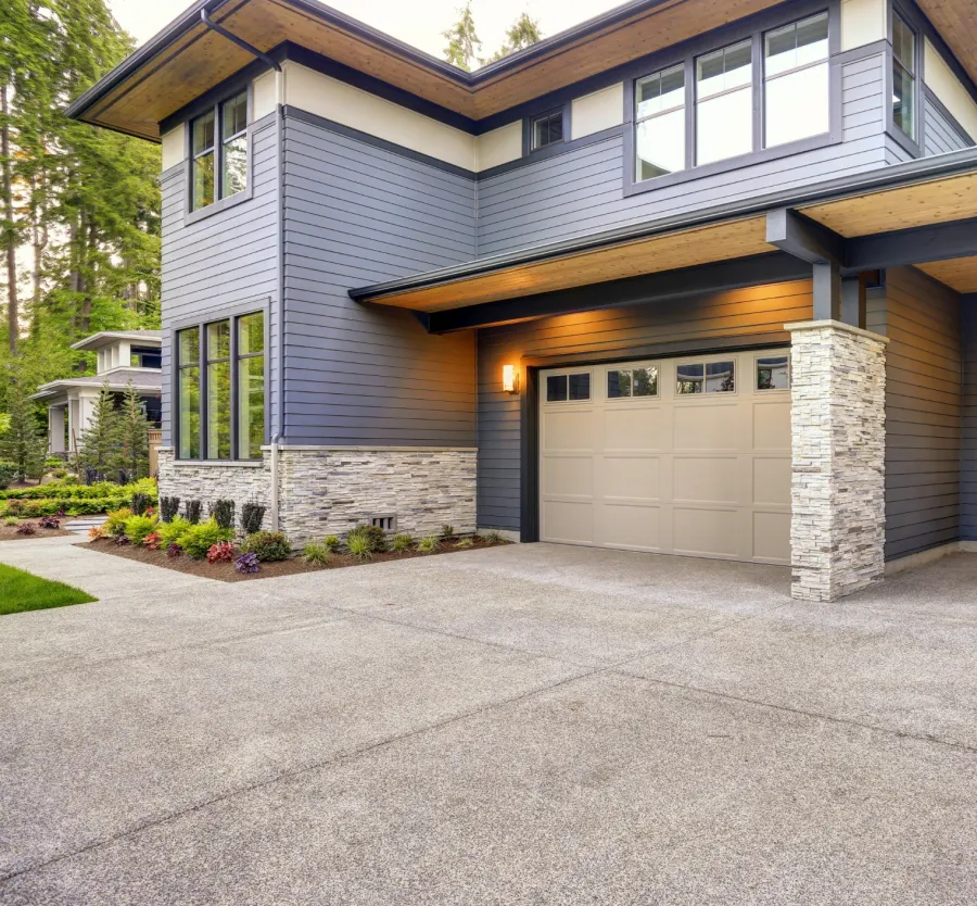 a house with garages and a driveway