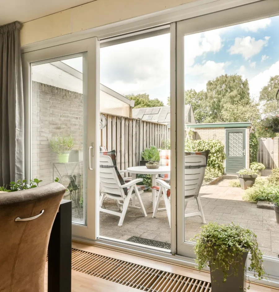 a patio with a table and chairs