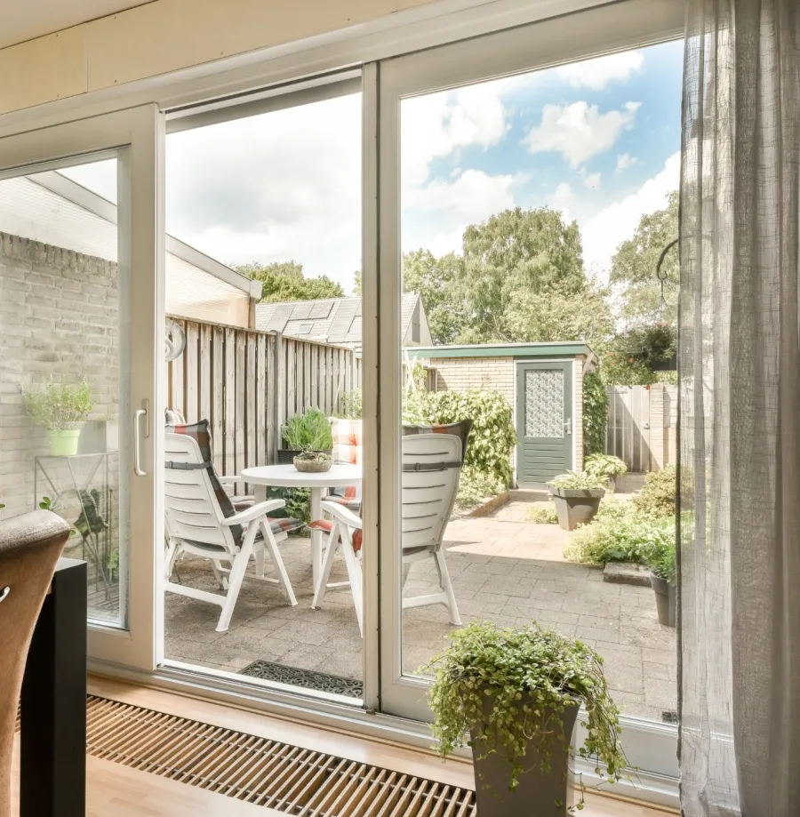 a patio with a table and chairs