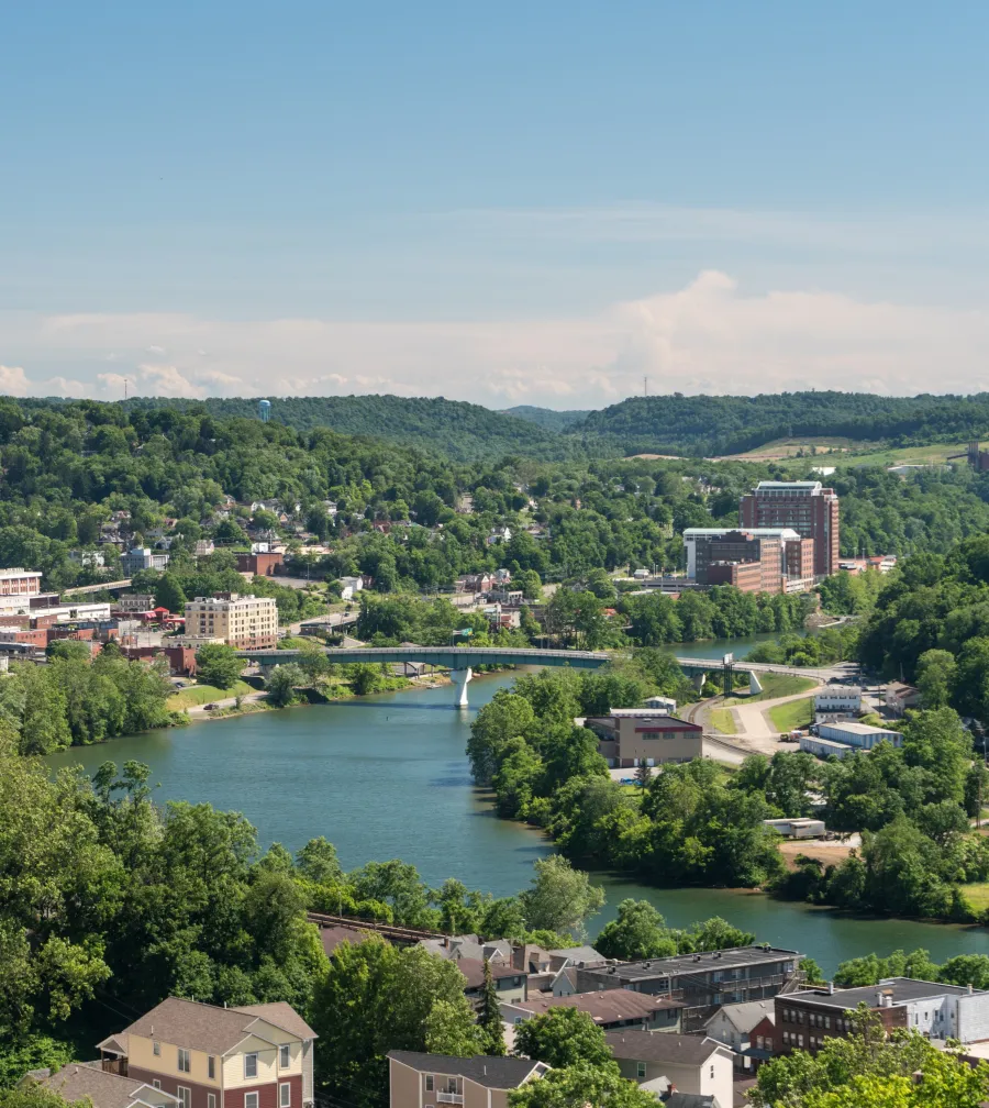 a river with buildings and trees around it