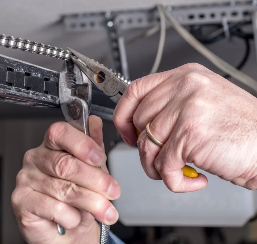 close-up of hands holding a metal piece