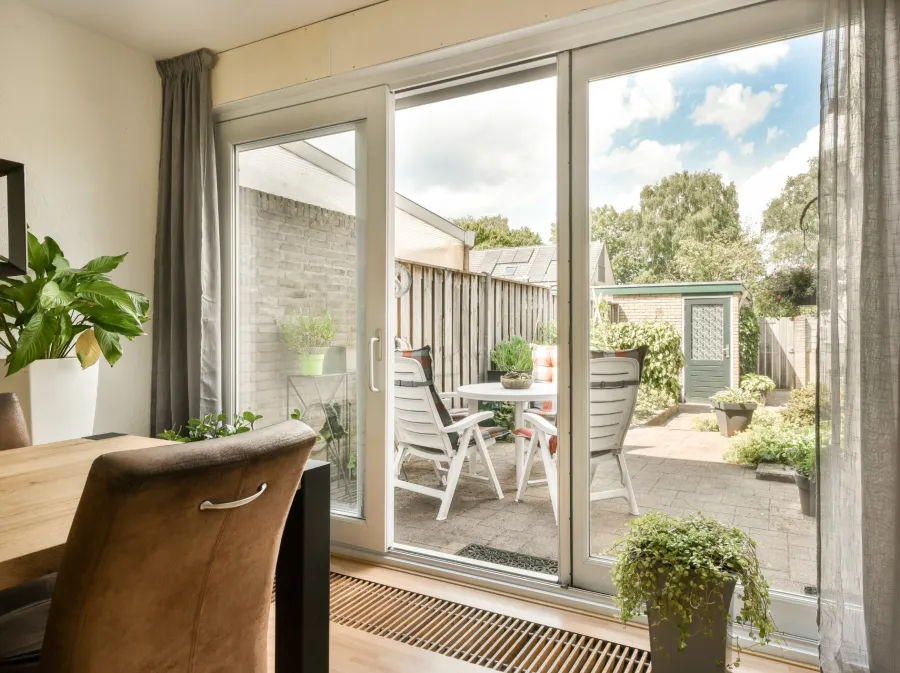 a patio with a table and chairs