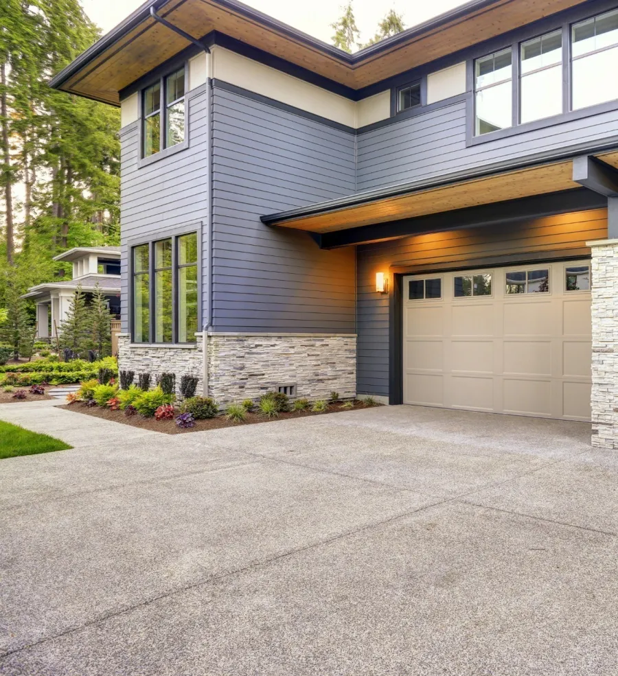 a house with garages and a driveway