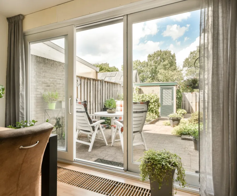 a patio with a table and chairs