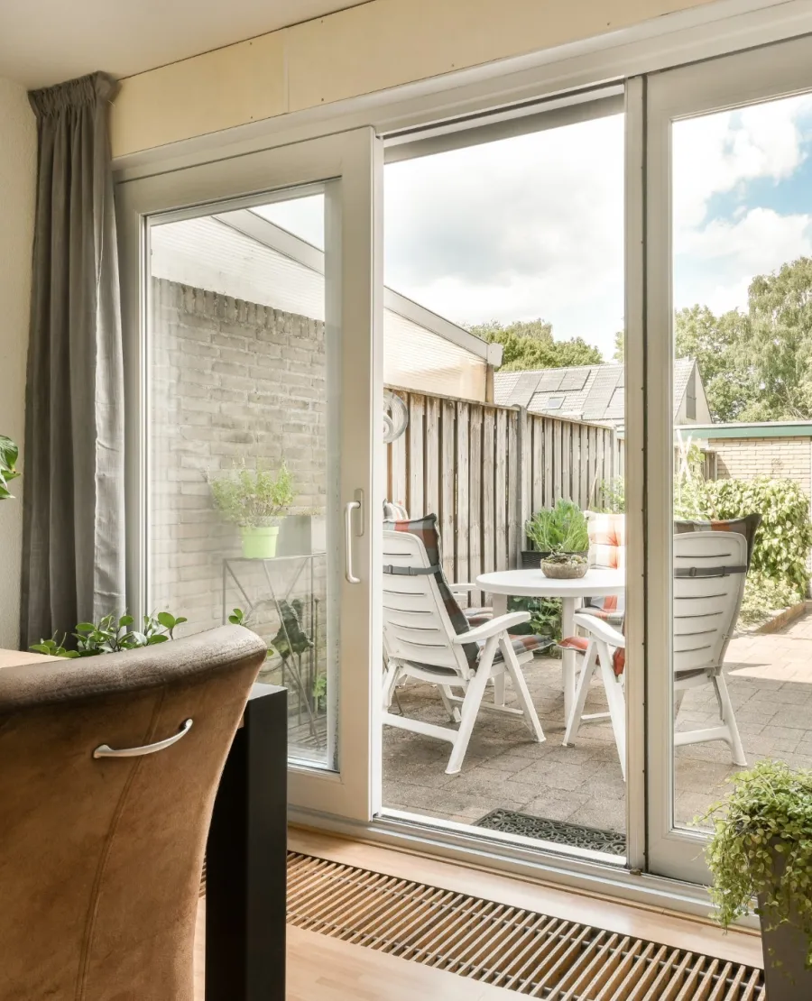 a patio with a table and chairs