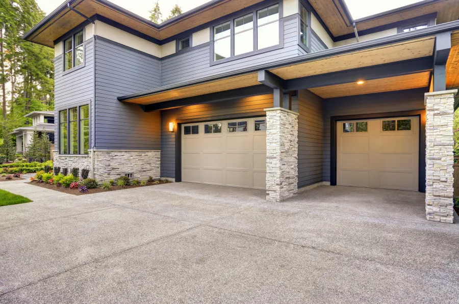 a house with garages and a driveway