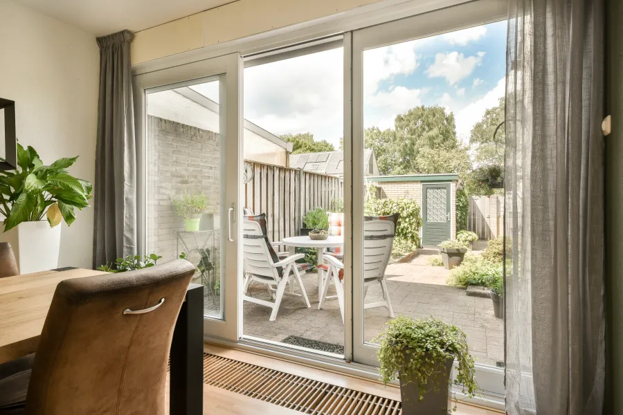 a patio with a table and chairs