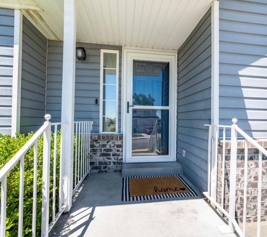 a porch with a railing and a railing