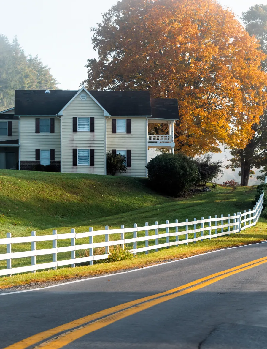 a house with a white picket fence