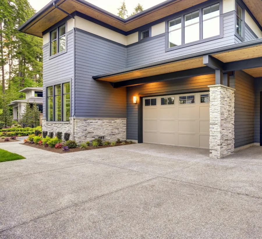 a house with garages and a driveway