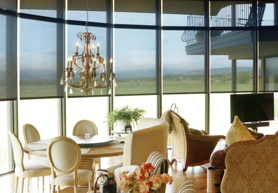 a living room with a chandelier and a fireplace