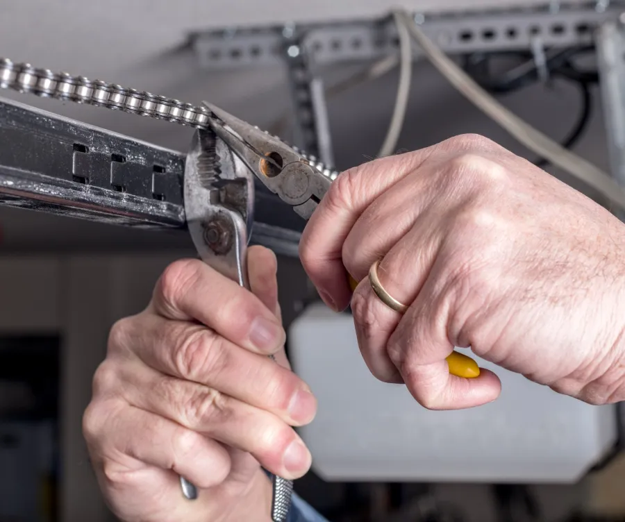 close-up of hands holding a metal piece