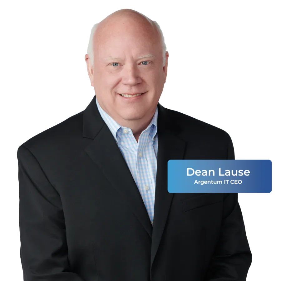 Professional portrait of Dean Lause, CEO of Argentum IT, wearing a black suit and light blue shirt.
