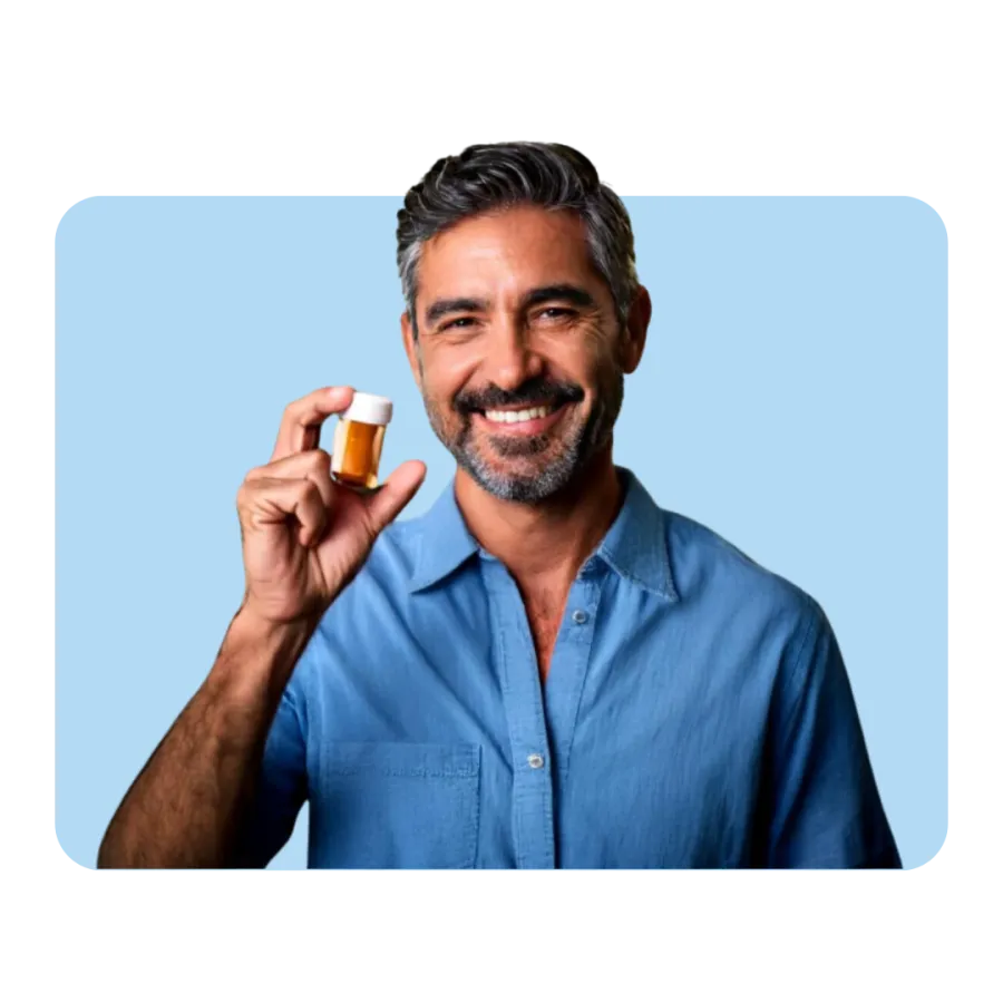 a man holding a glass of beer