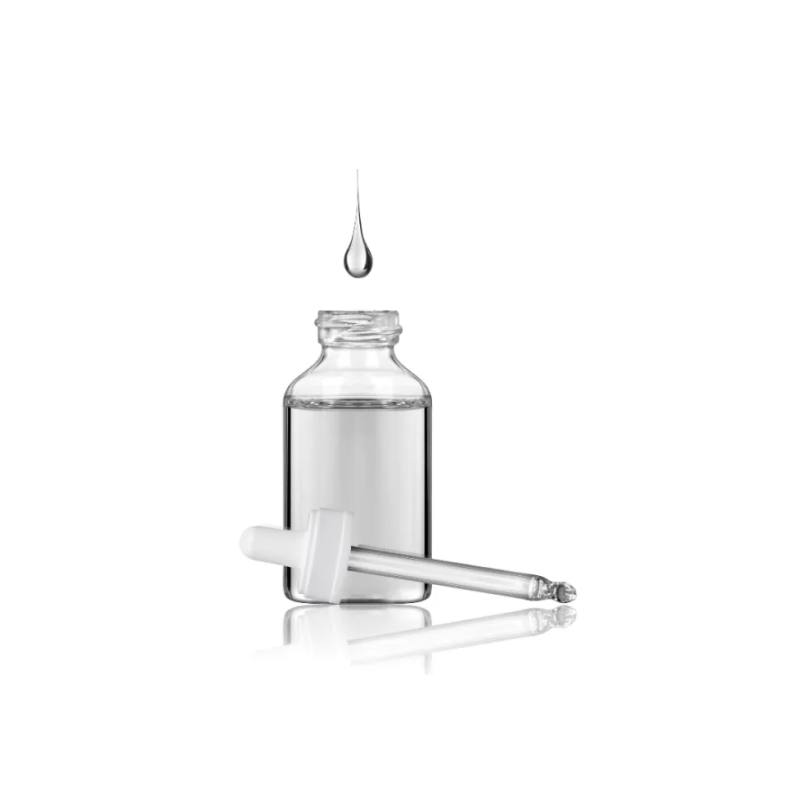 Clear glass dropper bottle filled with liquid and a drop falling above it on white background