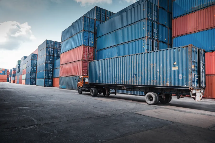 a truck carrying containers