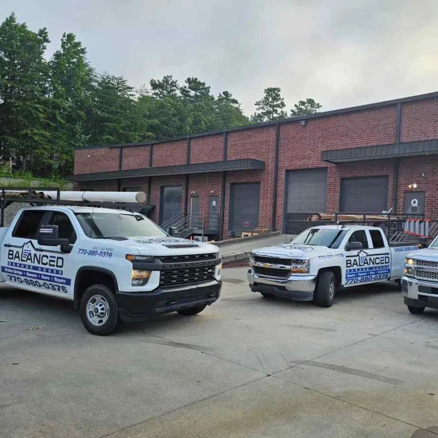 a couple of white and blue police cars parked in front of a brick building