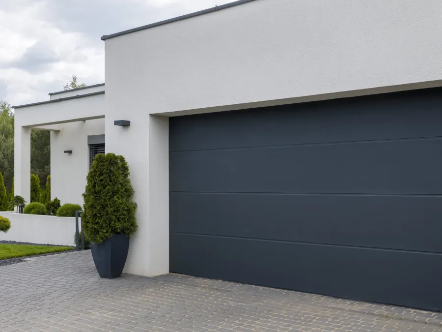 a building with a black garage