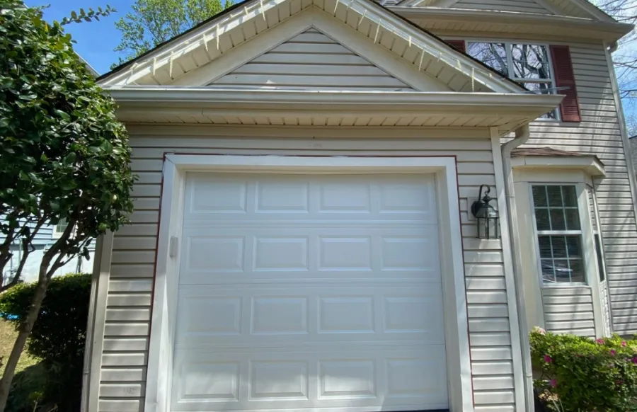 a white garage door with New Walk Museum in the background