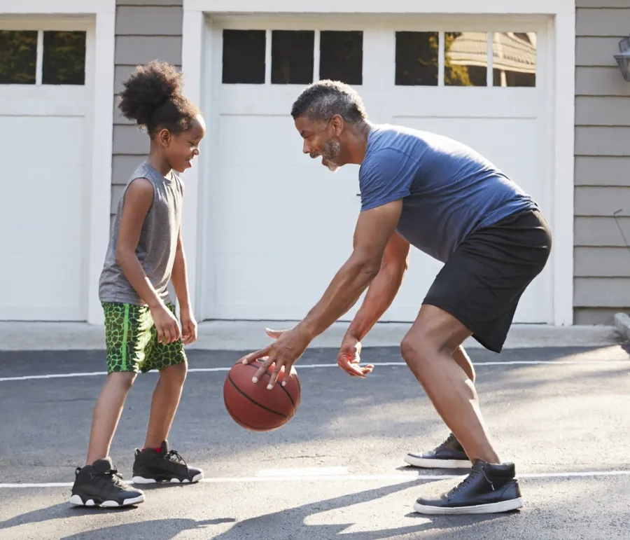 a man and a woman playing basketball