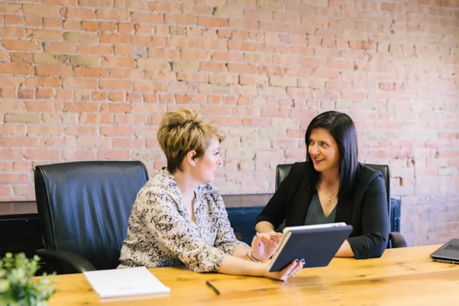 a few women sitting at a table