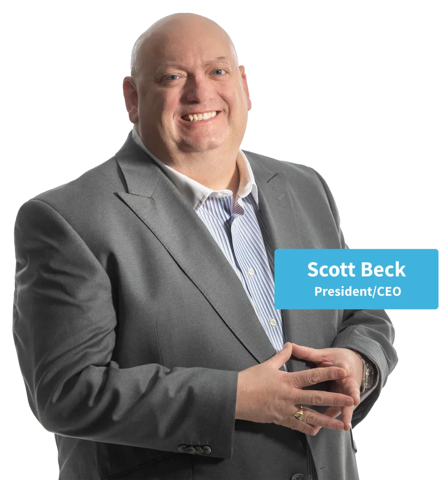 Smiling bald man in gray suit and striped shirt posing confidently with hands clasped.