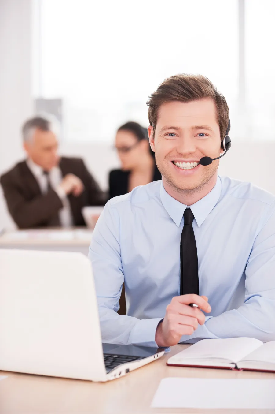 a man wearing a headset and a tie