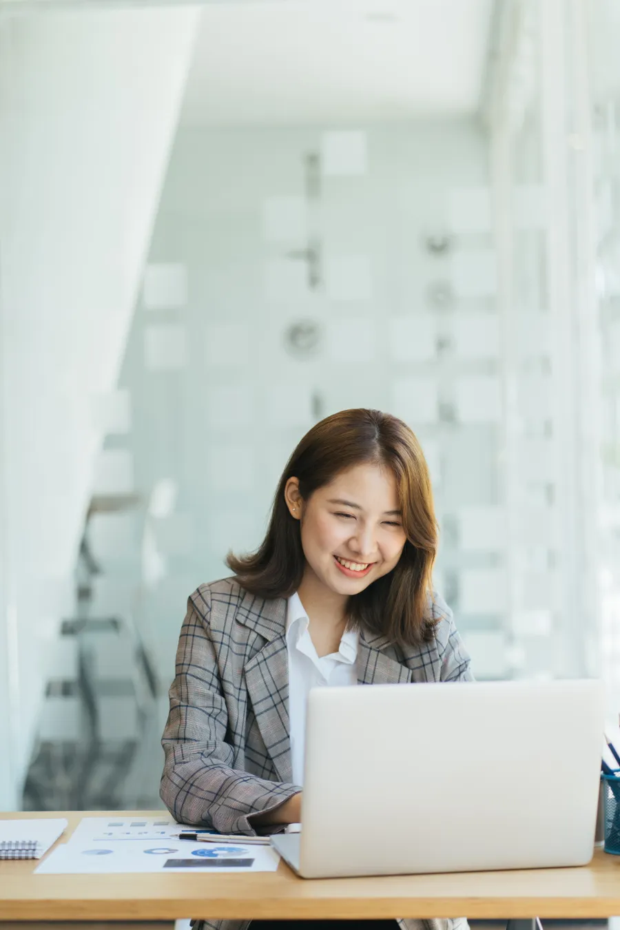 a woman working on her laptop
