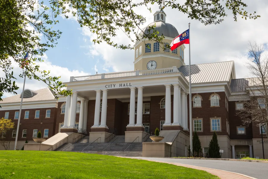 a large building with a flag on the front