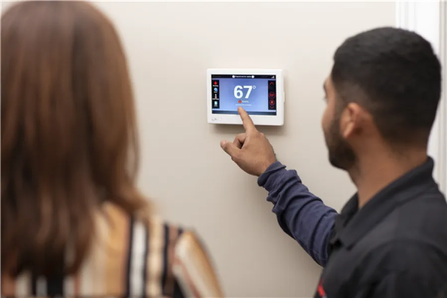 a man and a woman looking at a screen