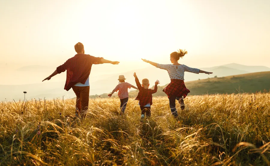 a group of people running in a field