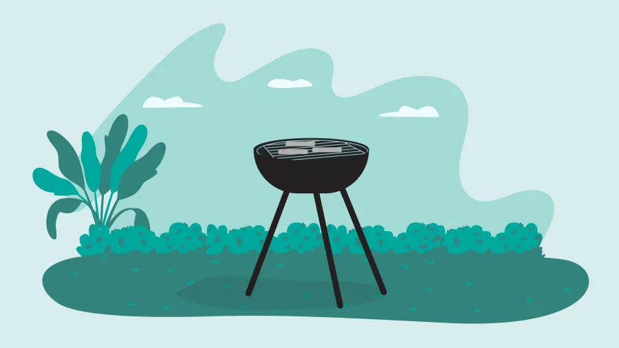 Outdoor charcoal grill standing on grass with plants and bushes in the background under a blue sky.