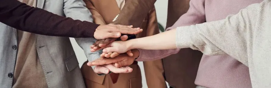 a group of people shaking hands