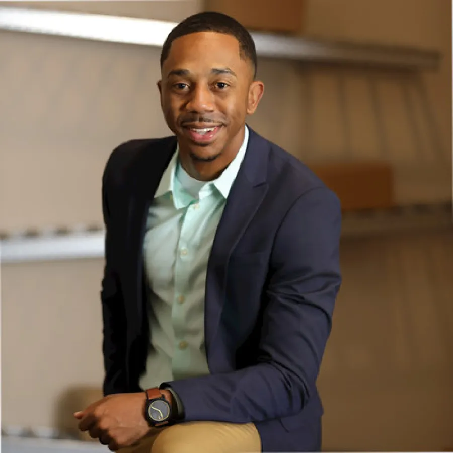 a person in a suit smiling