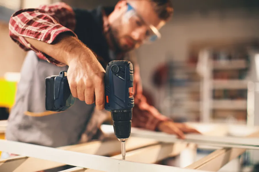 builder with screwdriver
