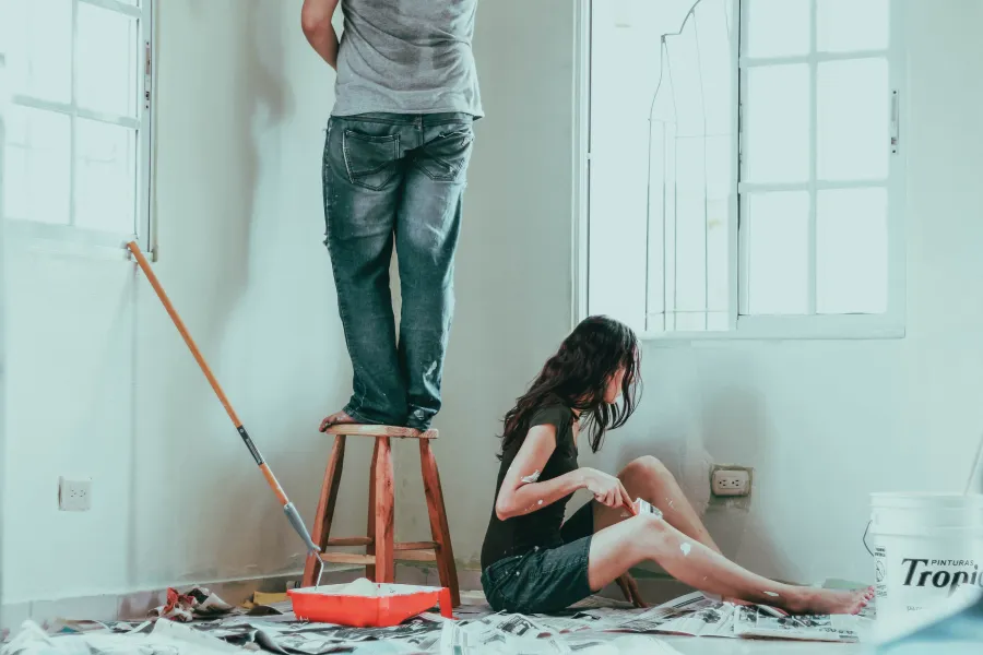 a person painting a room