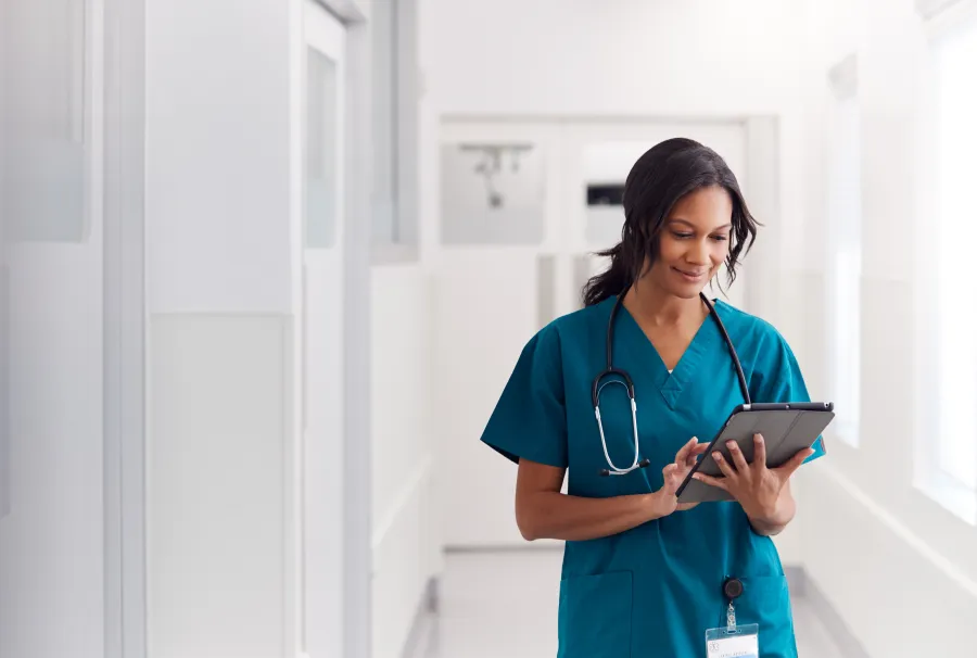 a nurse holding a tablet
