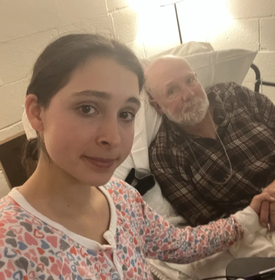 A volunteer offers support to a dying man at Heart of Mary House Hospice