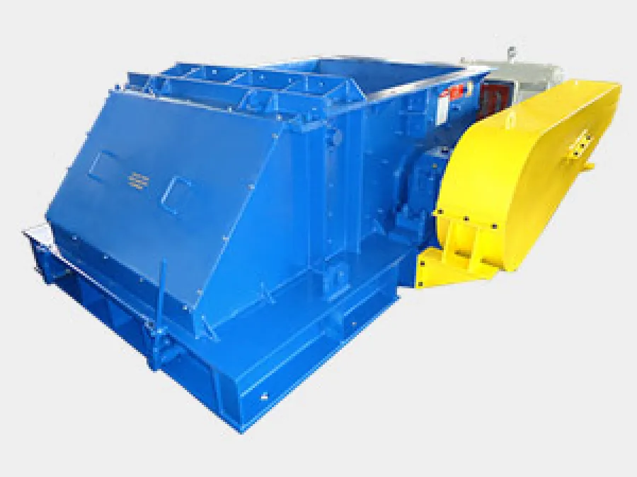 Industrial green baler machine compressing cardboard bales inside a warehouse.