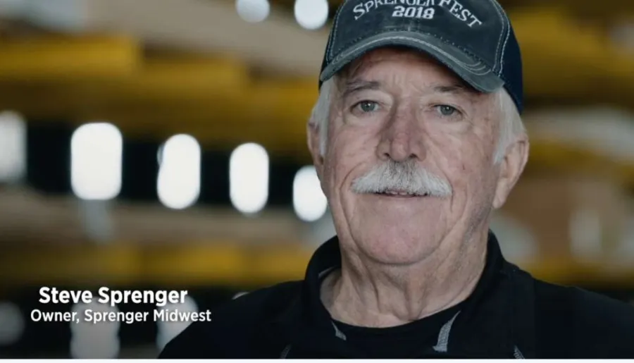 Portrait of Steve Sprenger wearing a Sprengler Fest 2018 cap with text overlay identifying him as owner of Sprenger Midwest