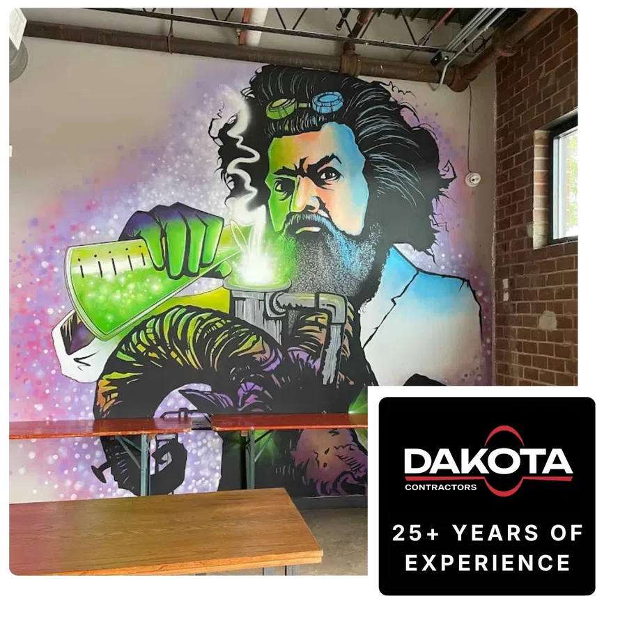 Colorful mural of a scientist with goggles pouring glowing green liquid into a container on a brick wall indoors.