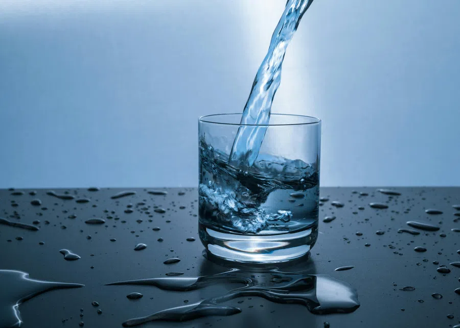 a glass with water in it