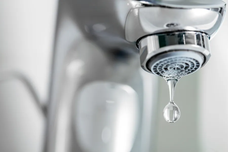 a drop of water falling into a glass