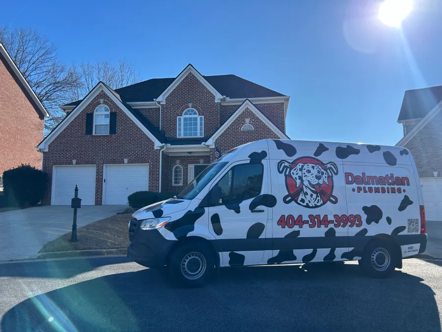 Dalmatian Plumbing repairing a broken kitchen sink at a home in smyrna ga
