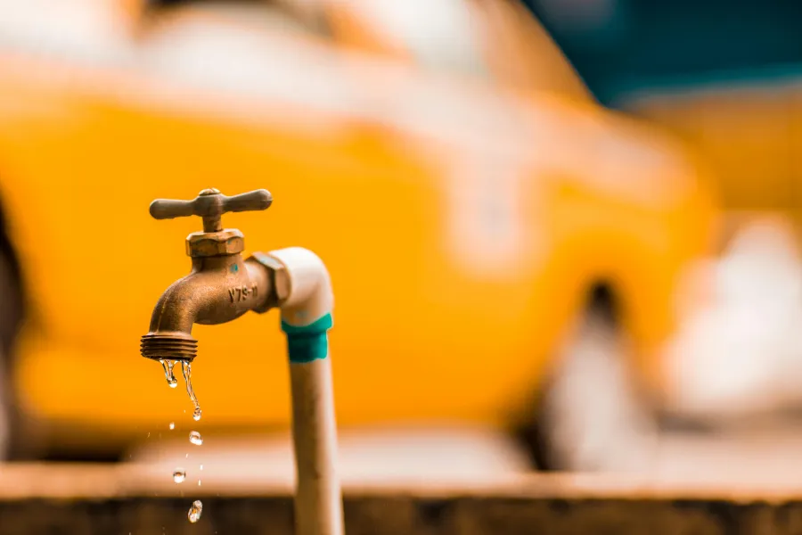 a faucet pouring water into a sink