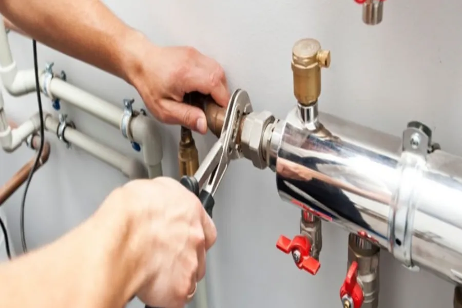 commercial plumber fixing an issue