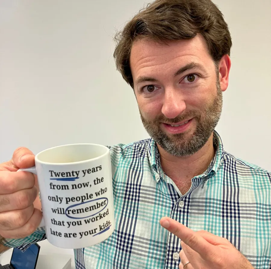 a man holding a coffee cup