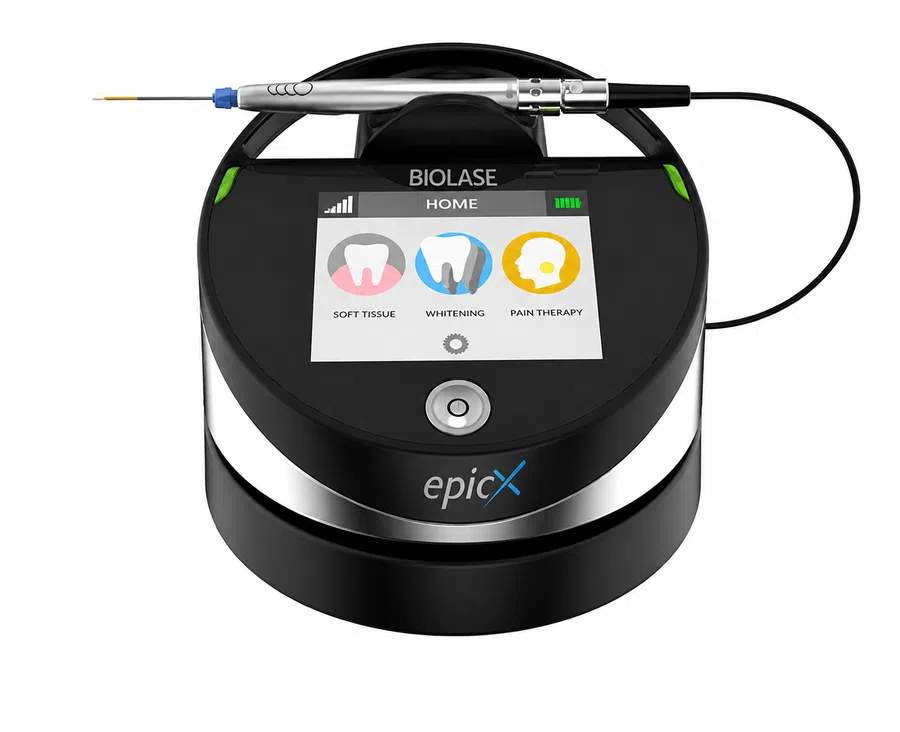 BIOLASE Epic X dental laser device on countertop with touchscreen showing soft tissue, whitening, and pain therapy modes